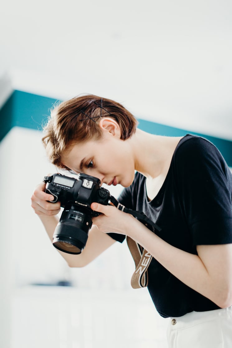 Woman in Black Top Holding Black Dslr Camera